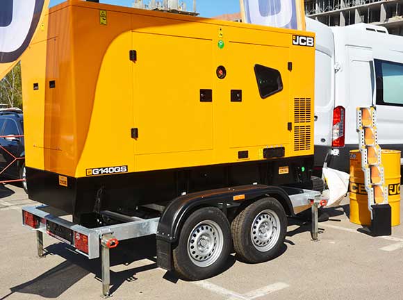 A yellow generator was loaded at the back of the truck.