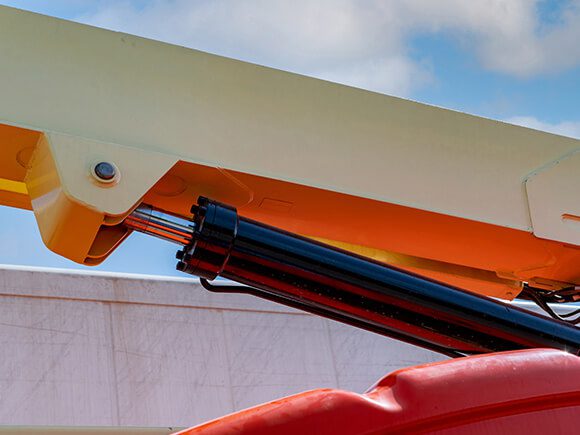 Close-up Cylinder Hydraulic of a Man Lift Equipment.