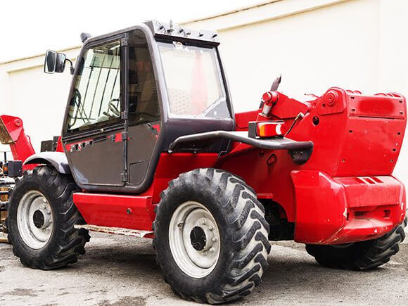 Rough terrain forklift rear side view.