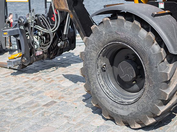 Damaged agricultural telescopic handler machine under maintenance.